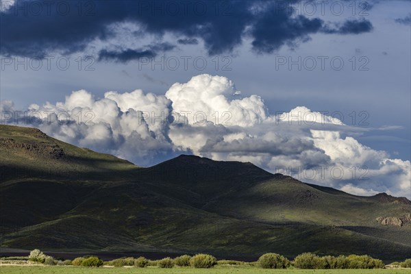 Majestic cumulus clouds above mountains