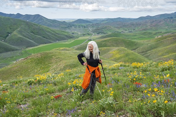 Senior blonde woman hiking on Carbonate Mountain trail