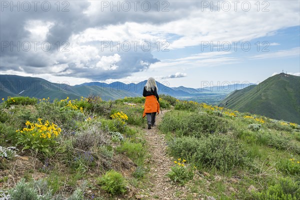 Senior blonde woman hiking on Carbonate Mountain trail