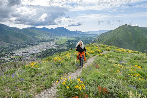 Senior blonde woman hiking on Carbonate Mountain trail