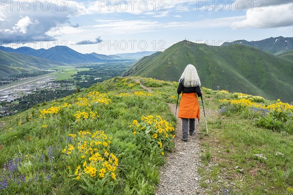 Senior blonde woman hiking on Carbonate Mountain trail