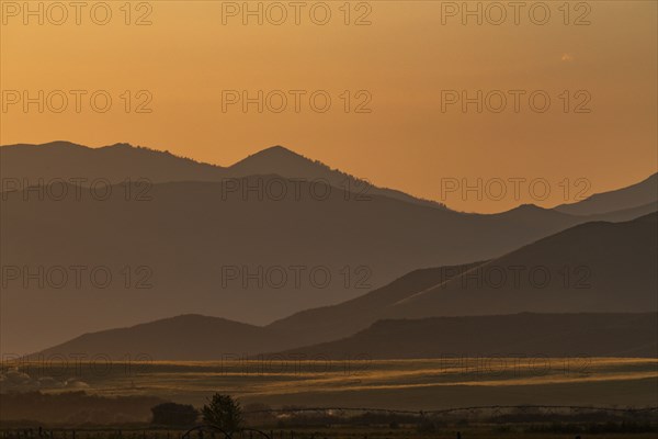 Scenic view of mountain landscape at sunset