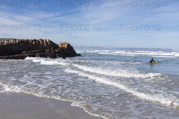 Boy bodyboarding