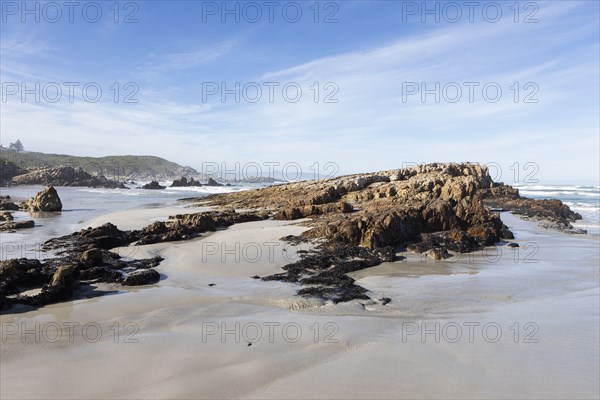 Rocky coastline in Kammabaai Beach on sunny day