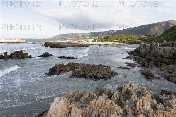 Rocky coastline of Atlantic Ocean in Voelklip Beach