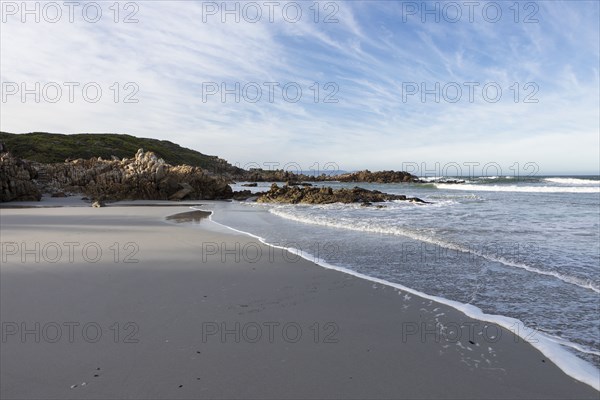Sandy coastline of Atlantic Ocean in Voelklip Beach