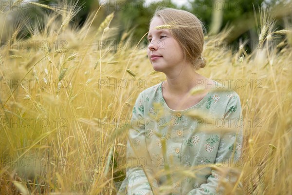 Young woman in wheat field