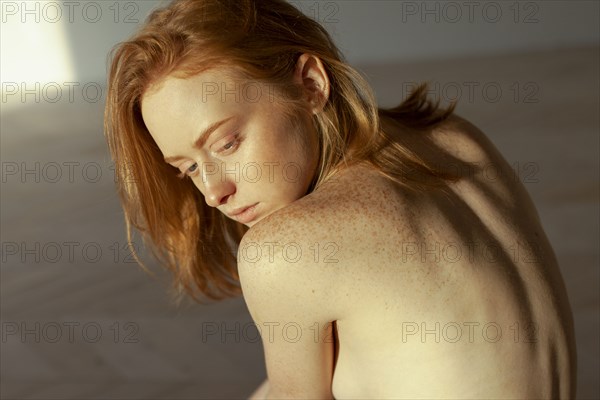 Portrait of redhead woman with freckles