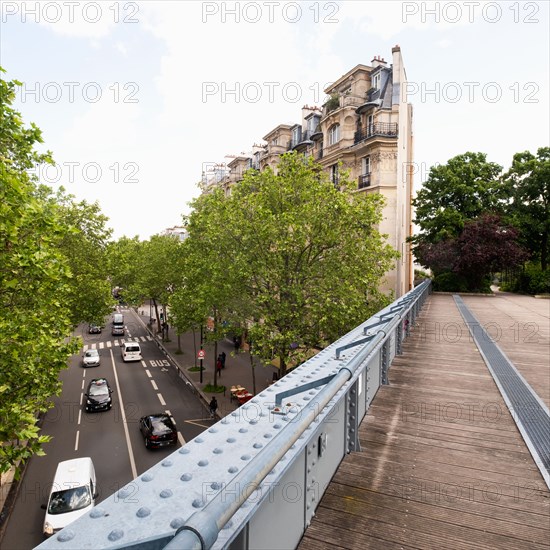 Pedestrian bridge above city street and traffic