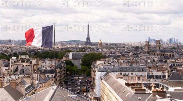 Cityscape with french flag and Eiffel tower in background
