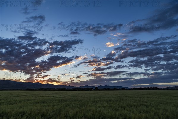 Sunrise over mountains and fields