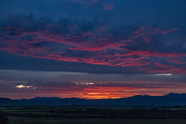 Beautiful sunset over silhouettes of mountains