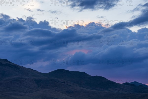 Beautiful dawn over silhouettes of mountains