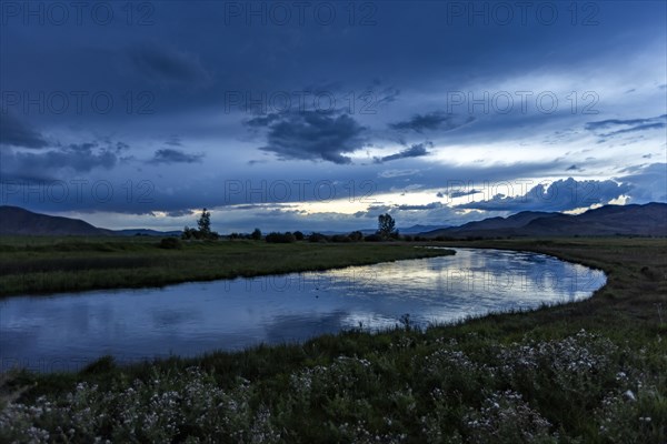 Reflection of evening storm in Silver Creek