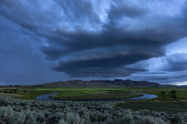 Arcus cumulonimbus storm clouds rolling across farmland