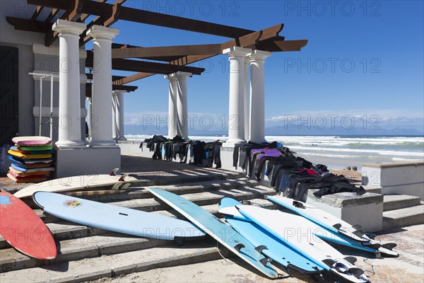 Surfboards and wetsuits on Muizenberg Beach