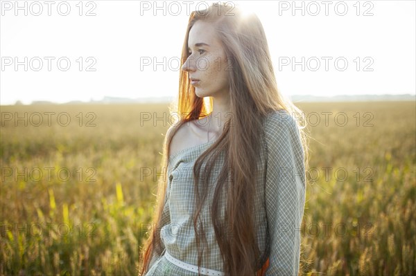 Beautiful woman posing in rural area