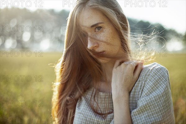 Beautiful woman posing in rural area