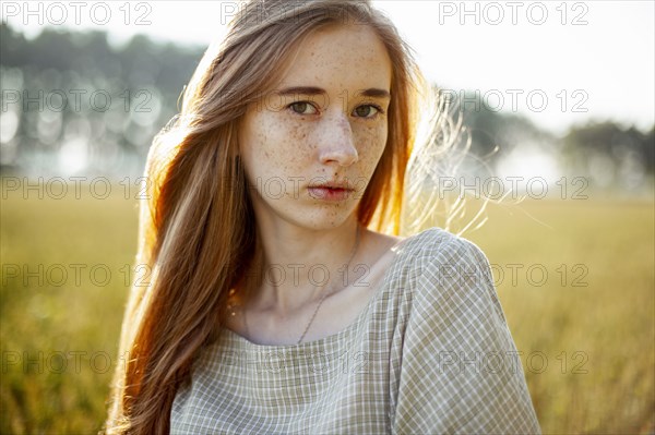 Beautiful woman posing in rural area