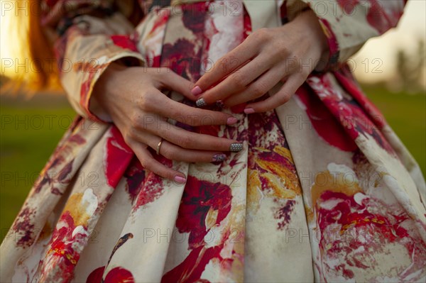 Mid section of woman wearing beautiful dress