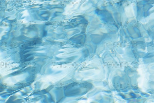 Abstract reflections on surface of pool water