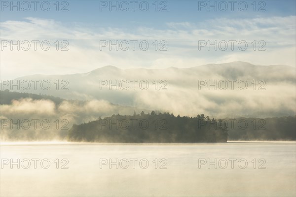 USA, NY, Island on Lake Placid in morning mist