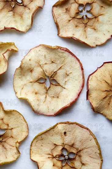 Close-up of baked apple slices on white background
