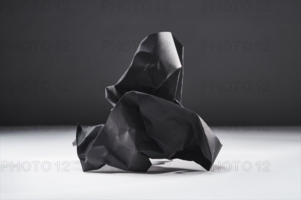 Studio shot of black crumpled paper