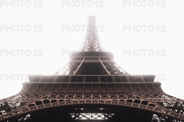 Low angle view of Eiffel Tower in mist