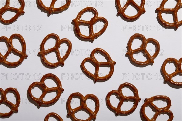 Overhead view of pretzels on white background