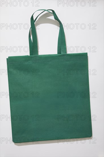 Green tote bag on white background