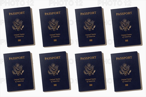 Rows of American passports on white background