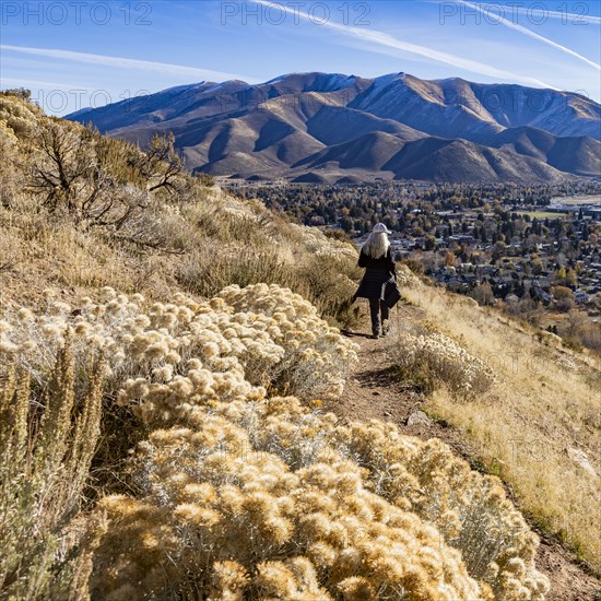 Rear view of woman hiking on Carbonate Mountain trail