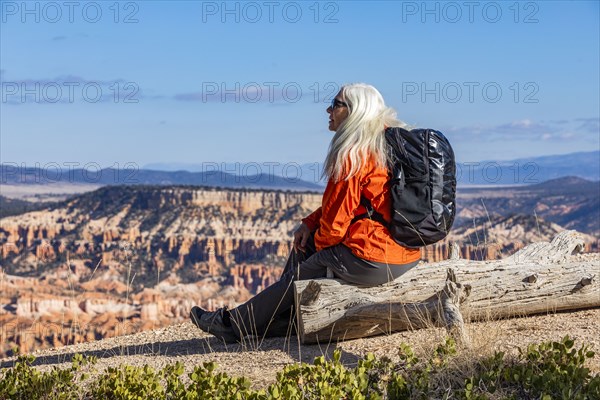 Senior woman with backpack looking at view in Bryce Canyon National Park