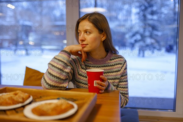 Portrait of woman having breakfast in cafe