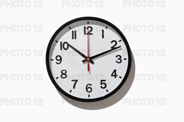 Studio shot of analog wall clock on white background