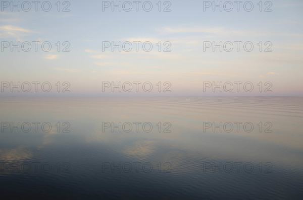 USA, New York, Hammond, Evening sky reflected in calm lake surface