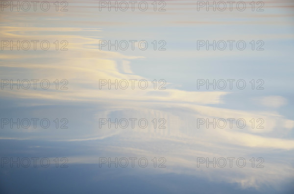 Evening sky reflected on lake surface