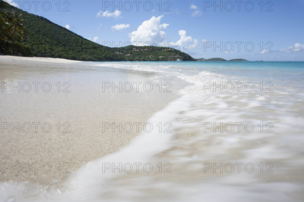USA, United States Virgin Islands, St. John, Close-up of surf washing sandy beach