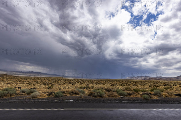 USA, Nevada, Winnemucca, Storm clouds over desert landscape