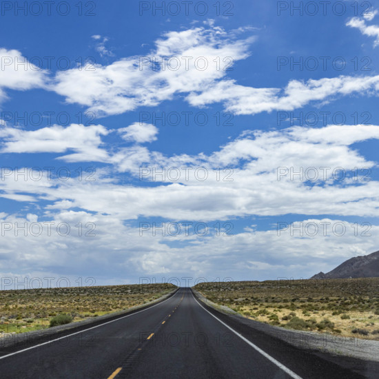 USA, Nevada, Winnemucca, Empty road and clouds seen from car