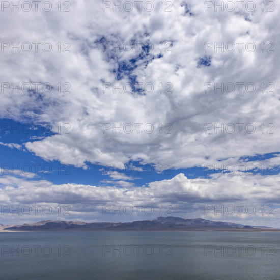 USA, Nevada, Henderson, White puffy clouds over calm Walker Lake