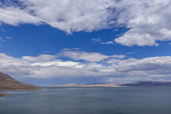 USA, Nevada, Henderson, White puffy clouds over calm Walker Lake