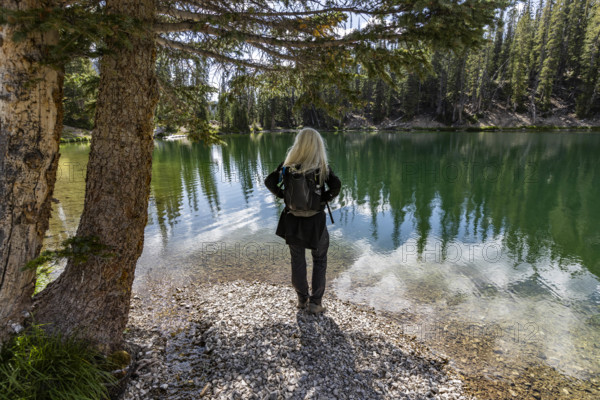 USA, Idaho, Sun Valley, Rear view of woman facing calm Norton Lake