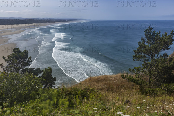 USA, Oregon, Newport, Sea waves washing empty beach