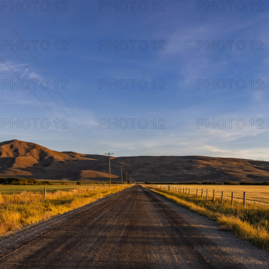 USA, Idaho, Bellevue, Empty dirt road in rural landscape