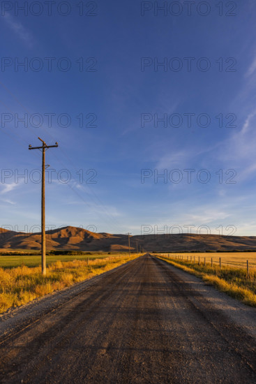 USA, Idaho, Bellevue, Empty dirt road in rural landscape
