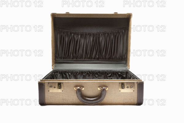 Open antique suitcase on white background