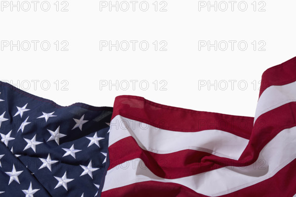 Wrinkled American flag on white background
