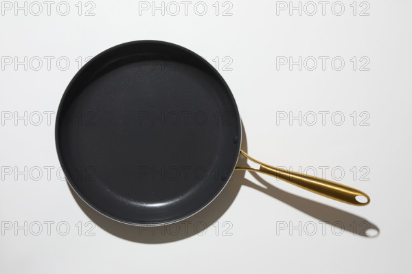 Torn blue glitter paper on white background